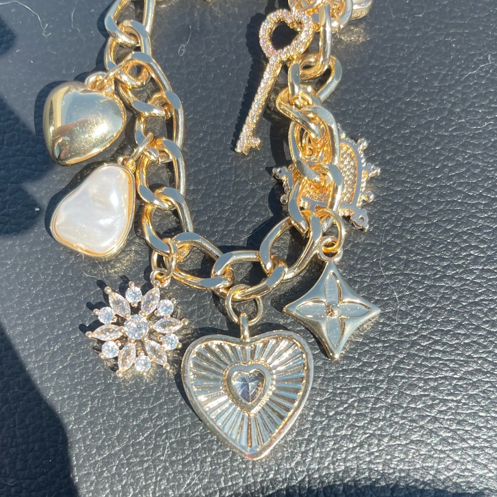 Gold Charm Bracelet with Heart and Star Accents